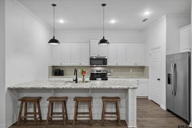 2736 Royal Village Way, Tyler, TX 75701 - kitchen featuring appliances with stainless steel finishes, crown molding, white cabinetry, backsplash, and recessed lighting