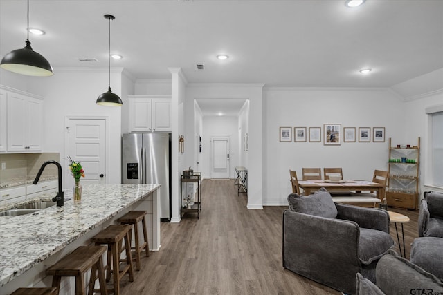 2736 Royal Village Way, Tyler, TX 75701 - living room with ornamental molding, wood finished floors, and recessed lighting