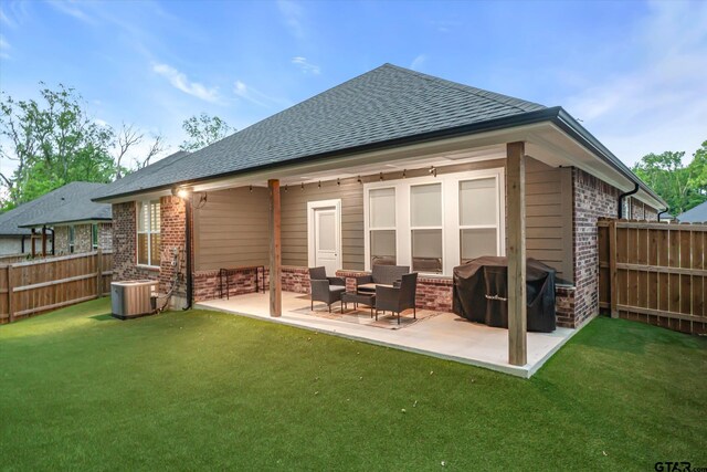 2736 Royal Village Way, Tyler, TX 75701 - rear view of property with brick siding, a patio area, and roof with shingles