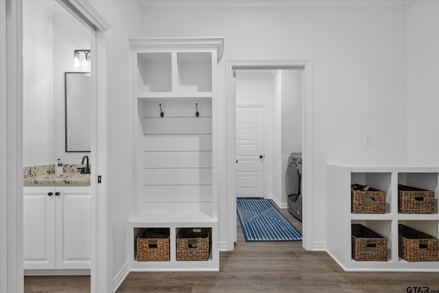 2736 Royal Village Way, Tyler, TX 75701 - mudroom with wood finished floors, washer / dryer, crown molding, and built in features