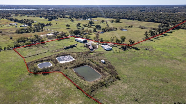 birds eye view of property featuring a rural view