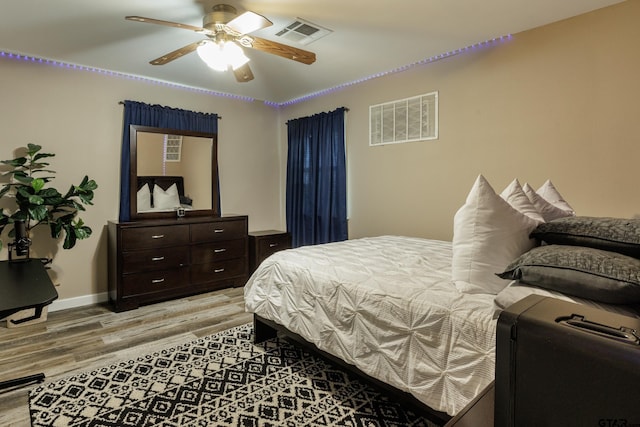 bedroom featuring ceiling fan and light wood-type flooring