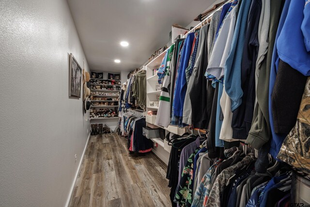 spacious closet featuring hardwood / wood-style floors