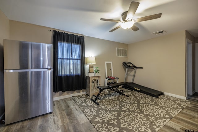 exercise area featuring ceiling fan and hardwood / wood-style flooring