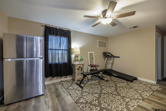 exercise area featuring ceiling fan and hardwood / wood-style flooring