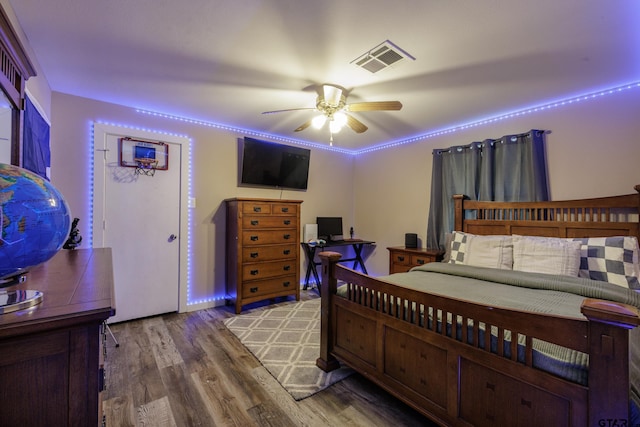 bedroom featuring ceiling fan and wood-type flooring