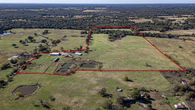 birds eye view of property featuring a rural view and a water view