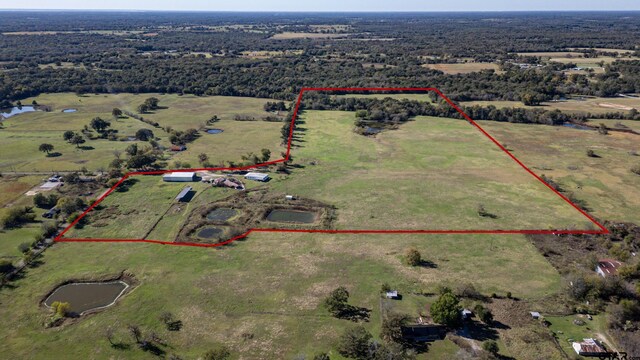 birds eye view of property featuring a rural view and a water view