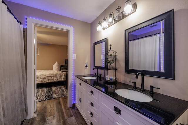 bathroom featuring hardwood / wood-style flooring and vanity