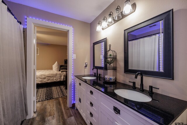 bathroom featuring hardwood / wood-style flooring and vanity