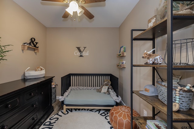 bedroom with ceiling fan and hardwood / wood-style floors