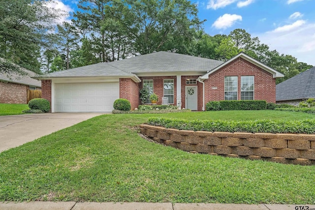 9196 Teal Flight Way, Tyler, TX 75703 - ranch-style house with a front yard, brick siding, a garage, and driveway