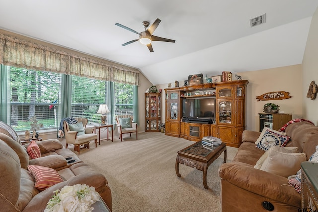 9196 Teal Flight Way, Tyler, TX 75703 - living room featuring a ceiling fan, light carpet, visible vents, and lofted ceiling