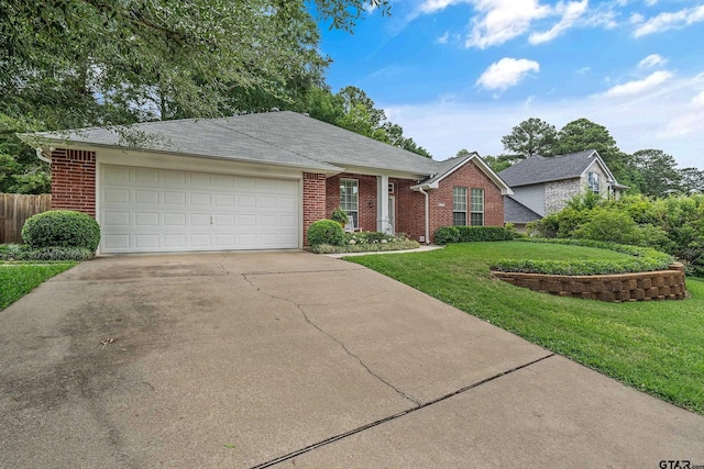 9196 Teal Flight Way, Tyler, TX 75703 - ranch-style home with a front lawn, brick siding, driveway, and a garage