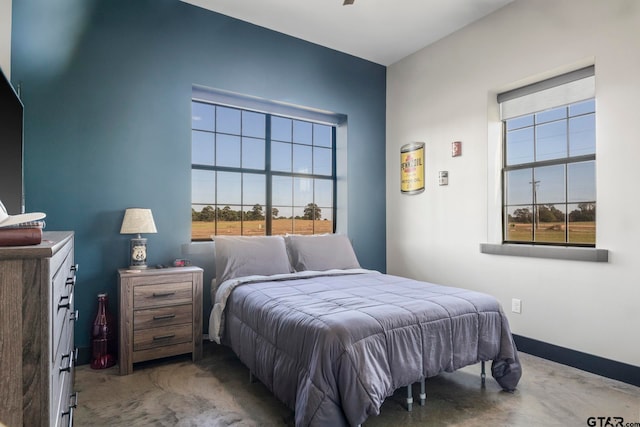 bedroom with multiple windows