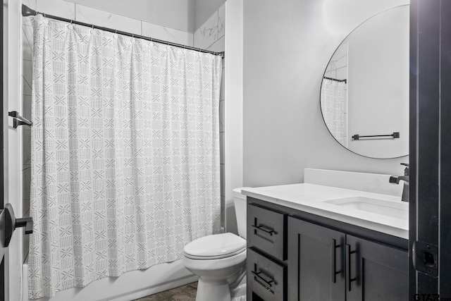 full bathroom with shower / tub combo, vanity, and toilet