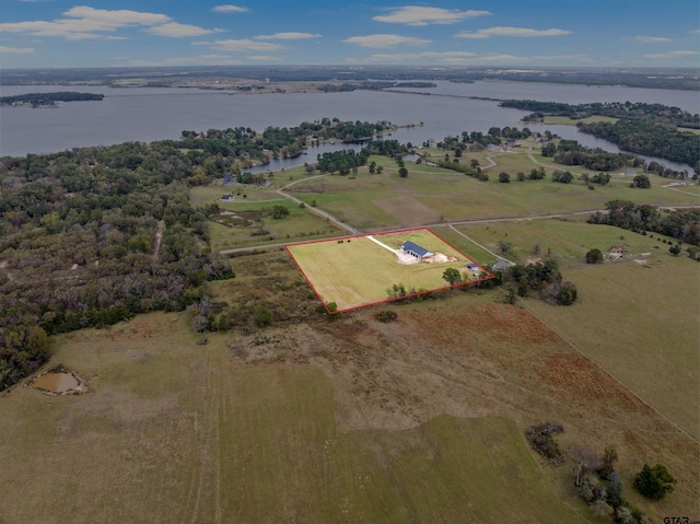 aerial view with a rural view and a water view