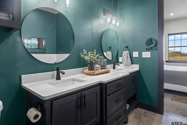 bathroom featuring vanity and concrete floors