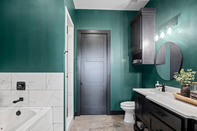 bathroom featuring vanity, toilet, and a bathing tub