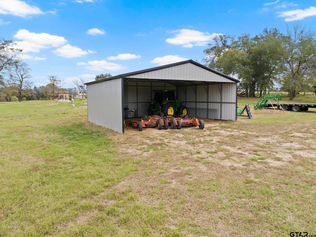 view of outbuilding featuring a lawn