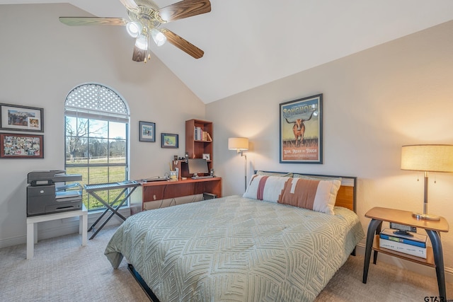 carpeted bedroom featuring high vaulted ceiling and ceiling fan