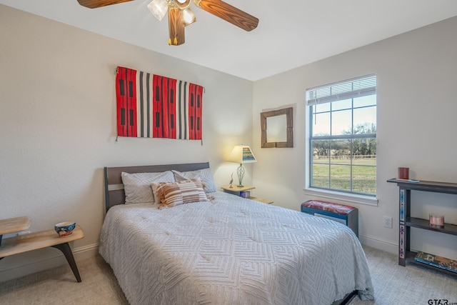 bedroom with ceiling fan and light colored carpet