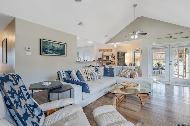 living room featuring wood-type flooring, french doors, high vaulted ceiling, and ceiling fan