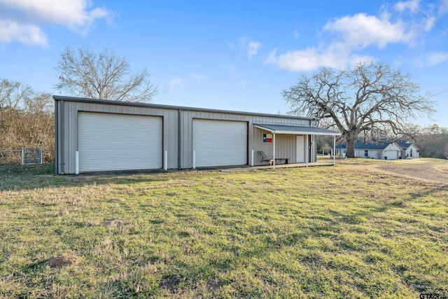 garage featuring a yard