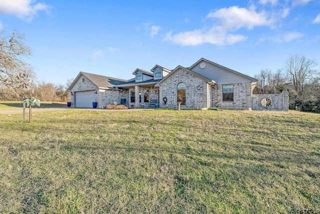 view of front of house with a garage and a front lawn