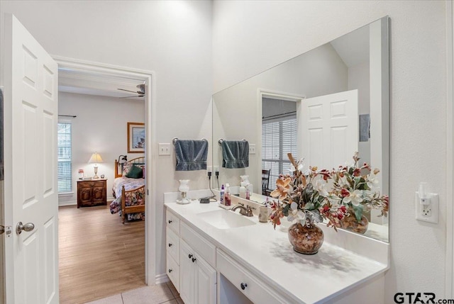 bathroom featuring vanity, hardwood / wood-style flooring, and ceiling fan