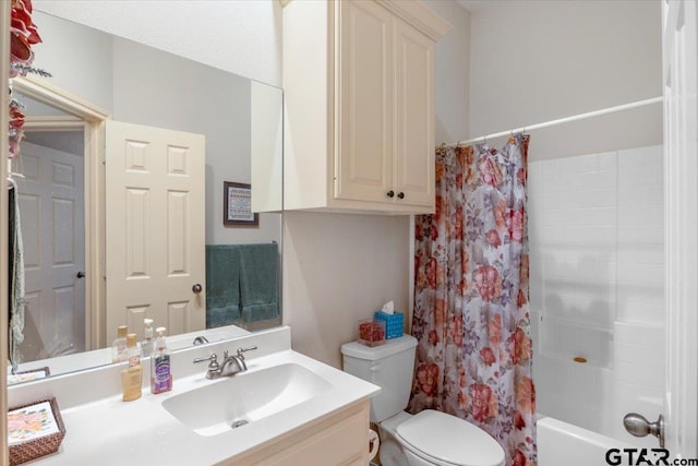 full bathroom featuring vanity, toilet, and shower / tub combo with curtain