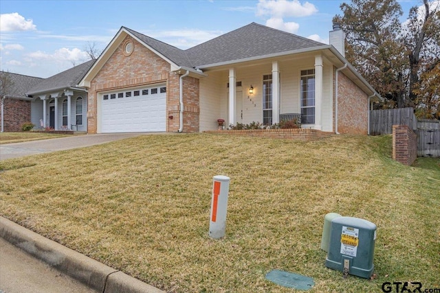 view of front of home with a porch, a garage, and a front yard