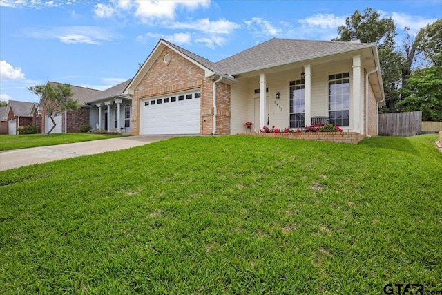 3413 Iberville Dr, Tyler, TX 75701 - ranch-style house featuring fence, a front yard, brick siding, an attached garage, and a porch