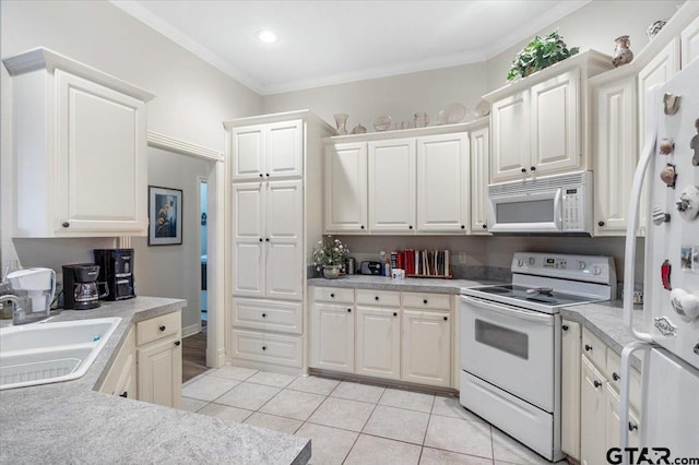 kitchen with sink, light tile patterned floors, white appliances, white cabinets, and ornamental molding