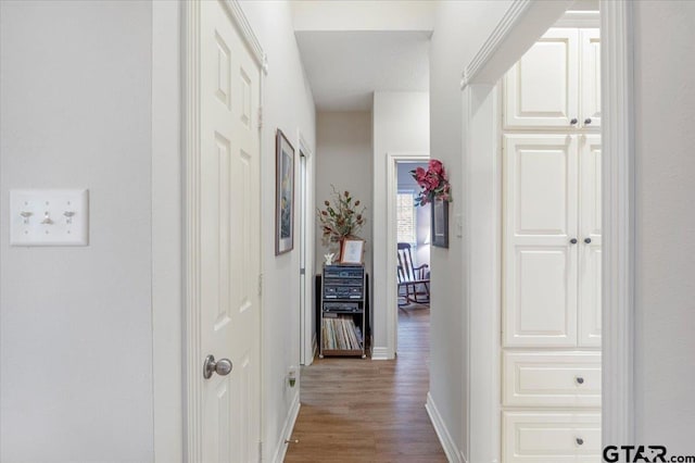 corridor featuring hardwood / wood-style floors