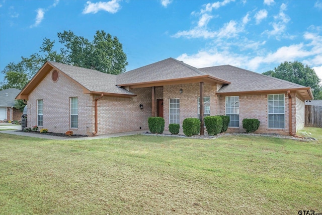 ranch-style house with a front yard