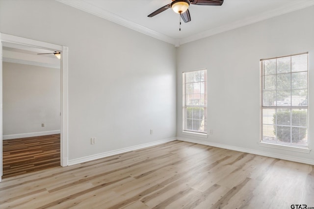 spare room featuring light wood-type flooring, ceiling fan, and crown molding