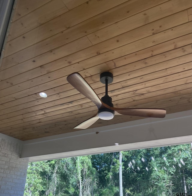 exterior details with wood ceiling and ceiling fan