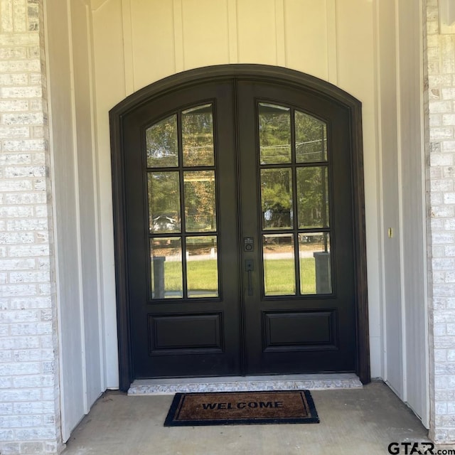 entrance to property featuring french doors