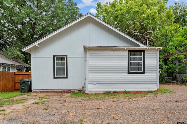 view of home's exterior with an outdoor structure