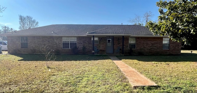 ranch-style house featuring a front lawn