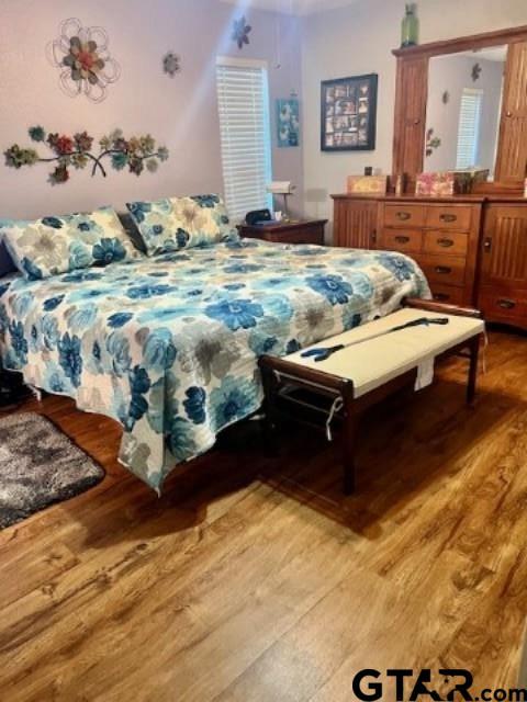 bedroom featuring hardwood / wood-style flooring