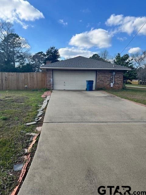 view of side of home featuring a garage