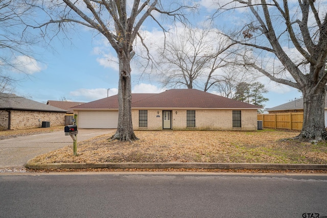 ranch-style home featuring a garage