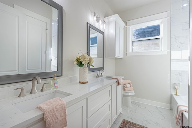 bathroom featuring vanity and toilet