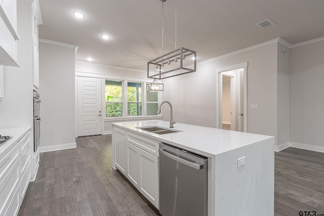 kitchen with pendant lighting, sink, appliances with stainless steel finishes, a kitchen island with sink, and white cabinets