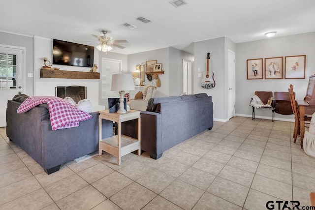 living room featuring ceiling fan and light tile patterned floors