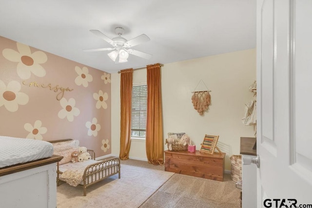 bedroom featuring light colored carpet and ceiling fan