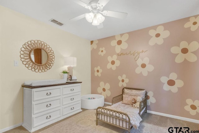 sitting room with light carpet and ceiling fan