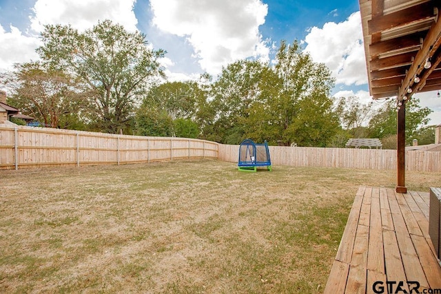 view of yard with a trampoline